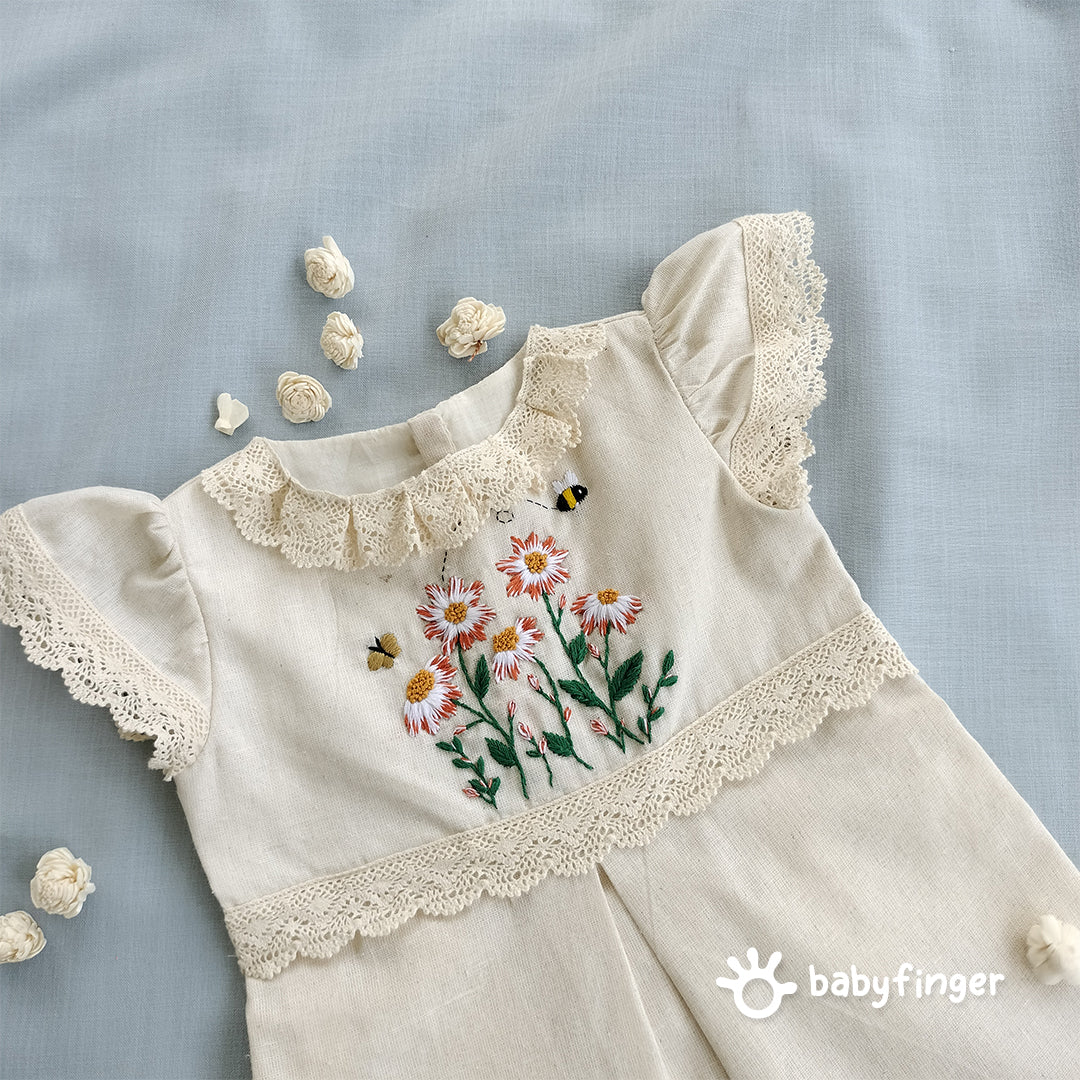 Hand-Embroidered Cream Floral Frock with Lace Sleeves.