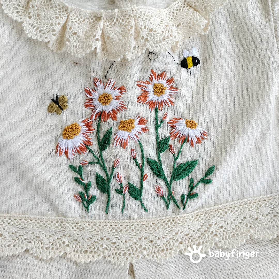 Hand-Embroidered Cream Floral Frock with Lace Sleeves.